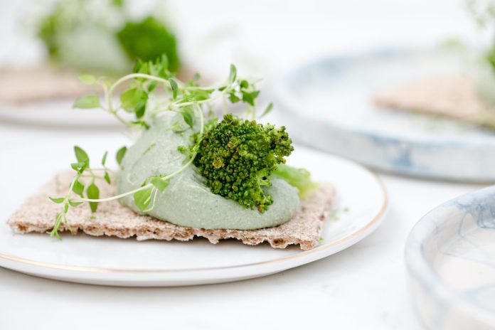 green vegetable on white ceramic plate